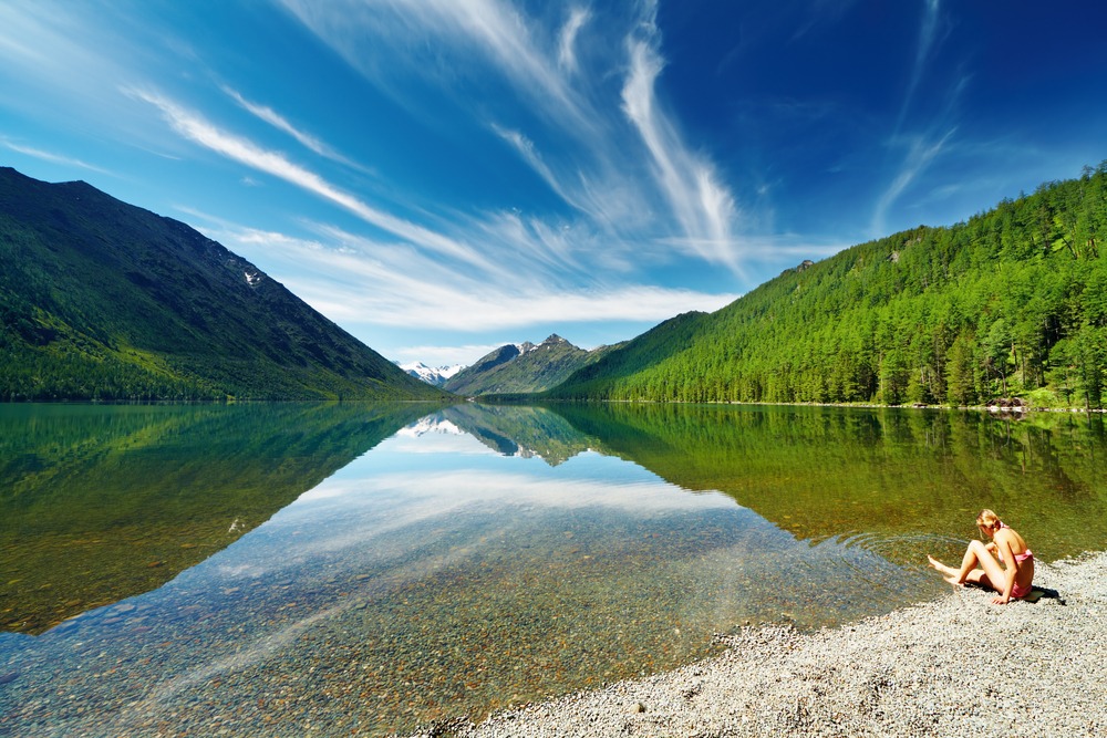 woman alone by lake