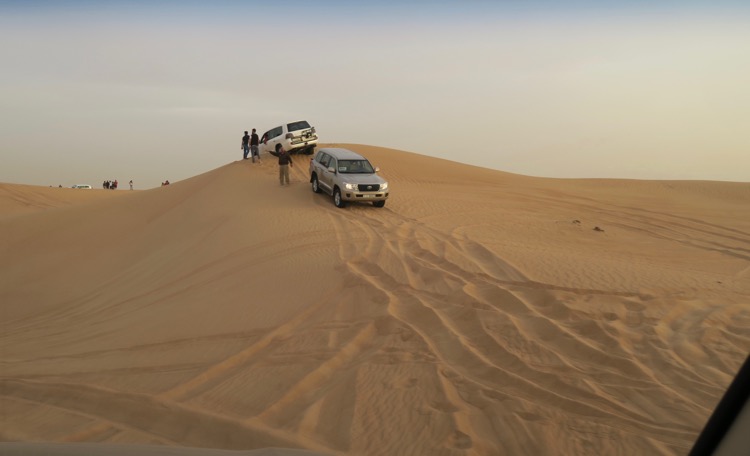 car stuck in sand dune