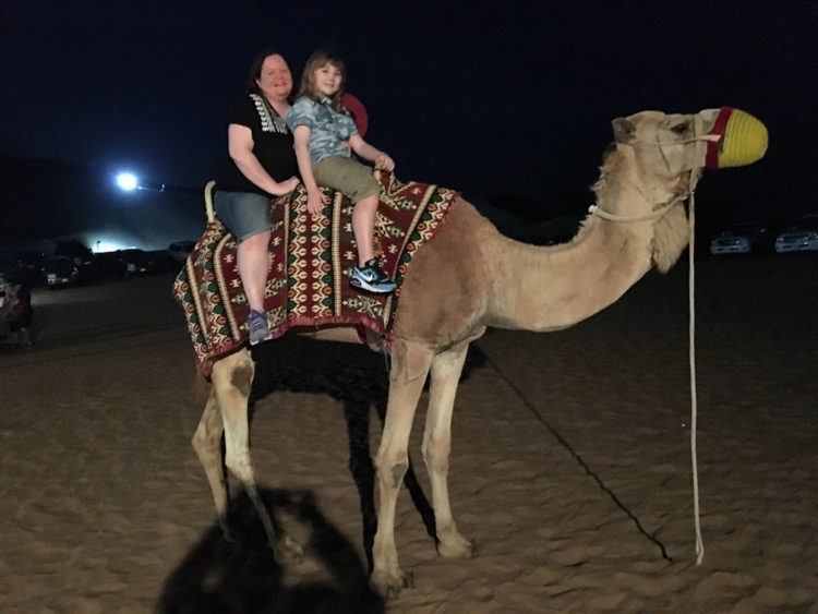 Ask the camel guide and he'll take a photo for you. 